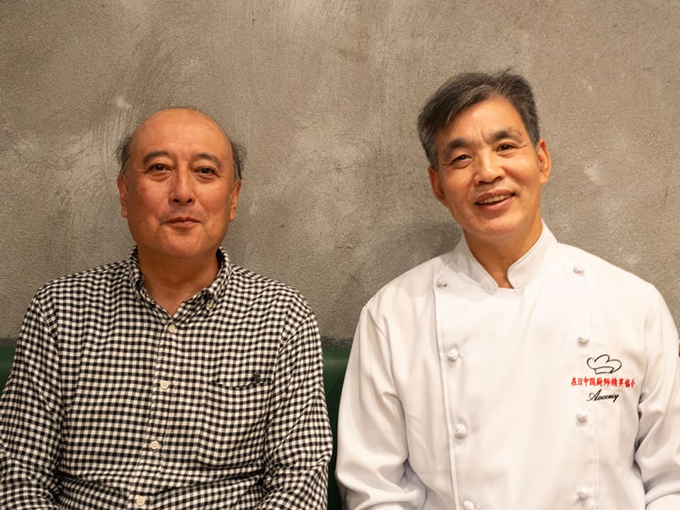 TDC 中村代表(写真左)と在日中国厨師精英協会会長 味坊取締副社長 明さん(写真右)